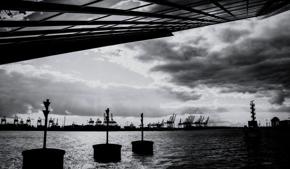 low-angle-view-bridge-against-cloudy-sky